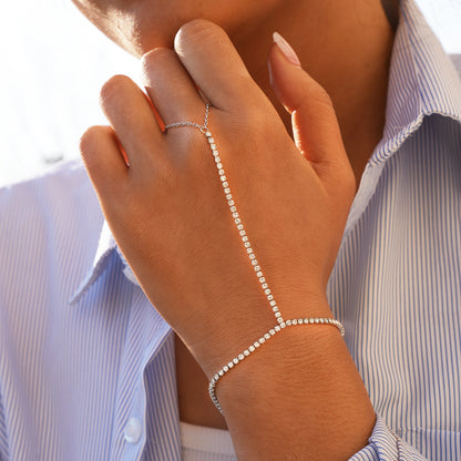 White crystal hand chain bracelet connecting the wrist and finger