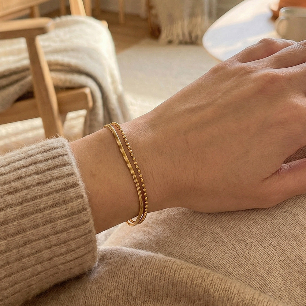 Gold layered bracelet on wrist snake chain ball chain adjustable extender