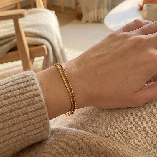 Gold layered bracelet on wrist snake chain ball chain adjustable extender
