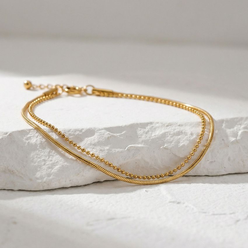 Gold layered bracelet snake chain ball chain stainless steel minimal flat lay