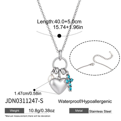 Silver stainless steel necklace with heart charm pearl accent and blue crystal cross pendant