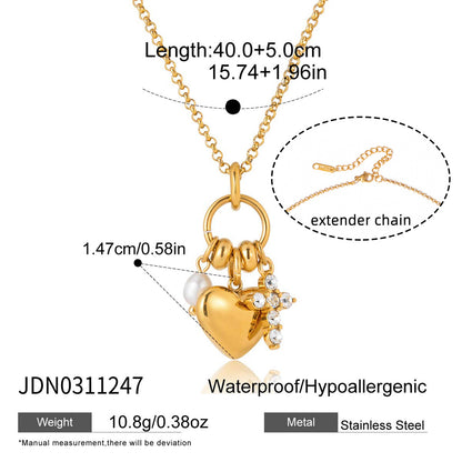 Gold stainless steel necklace with heart charm pearl accent and crystal cross pendant