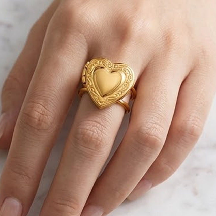 
Vintage inspired gold heart locket ring worn on the finger