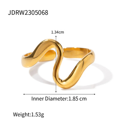 Gold tone stainless steel sculptural wave ring with size and weight details