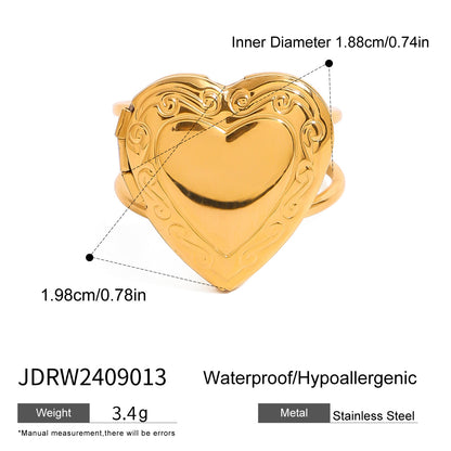 Gold stainless steel heart locket ring with engraved border and size details
