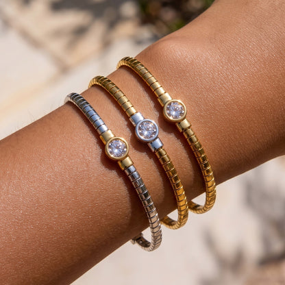 Stainless steel segmented bangle with round cubic zirconia