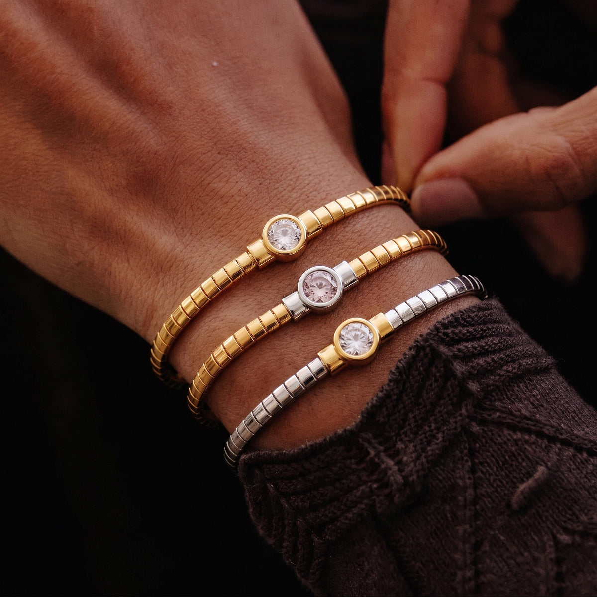 Stainless steel segmented bangle with round cubic zirconia