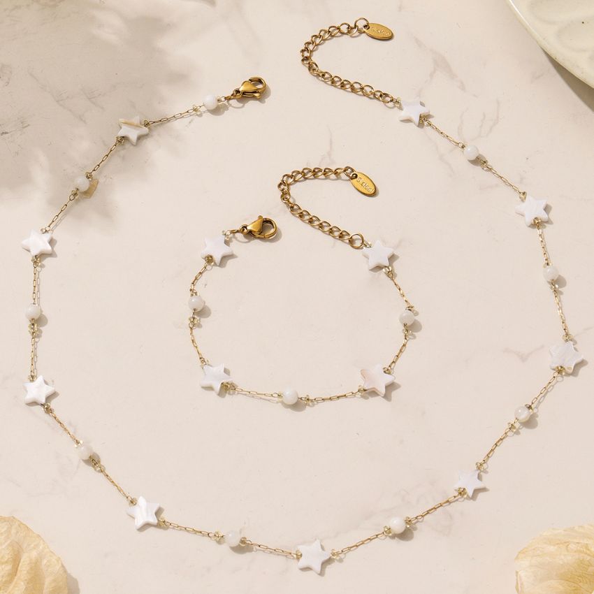 Star jewelry set flat lay shell star necklace and bracelet with extender chain