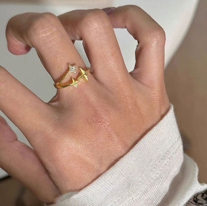 Gold tone S925 star wrap ring with sparkling four point star design