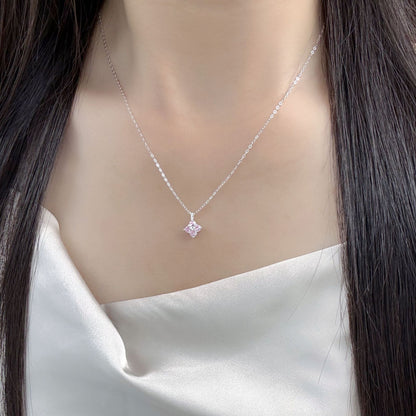 Model wearing a 925 sterling silver pink zircon four leaf clover pendant necklace.