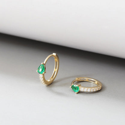 S925 sterling silver 18K gold plated huggie earrings featuring green teardrop cubic zirconia stones and pavé CZ details