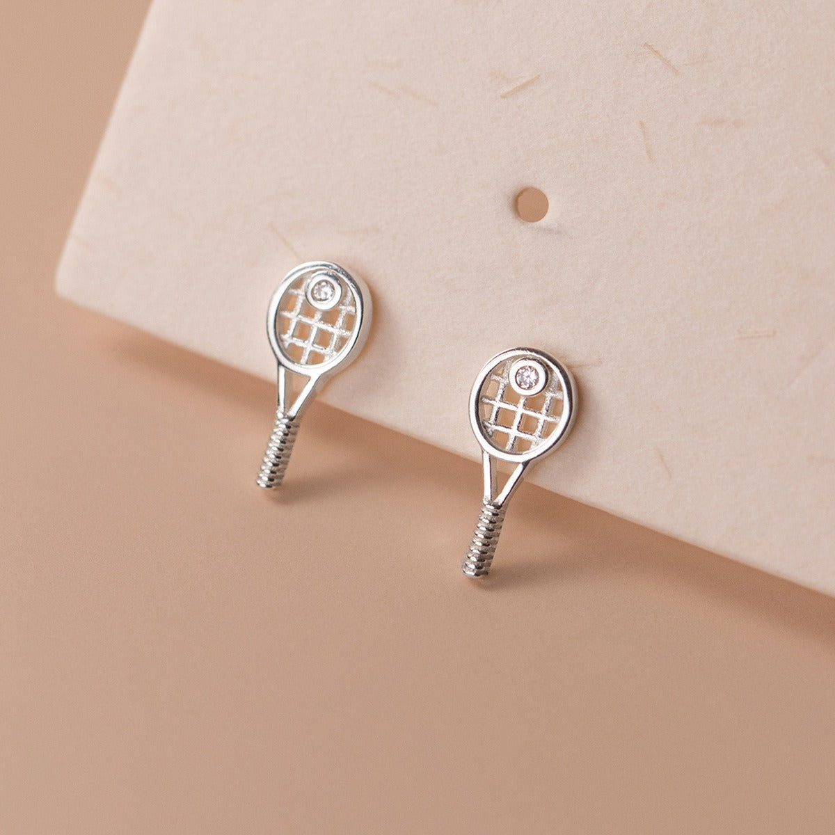 Wholesale sterling silver tennis racket earrings featuring minimalist sports inspired design