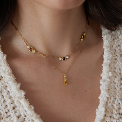 Two separately sold necklaces shown together for styling