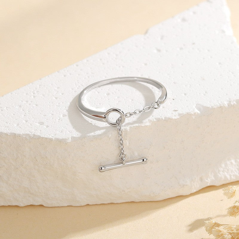Close up of S925 sterling silver open ring with chain link and T bar charm