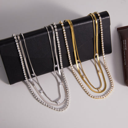 Gold and silver triple layer necklaces with tennis herringbone and square CZ station chains