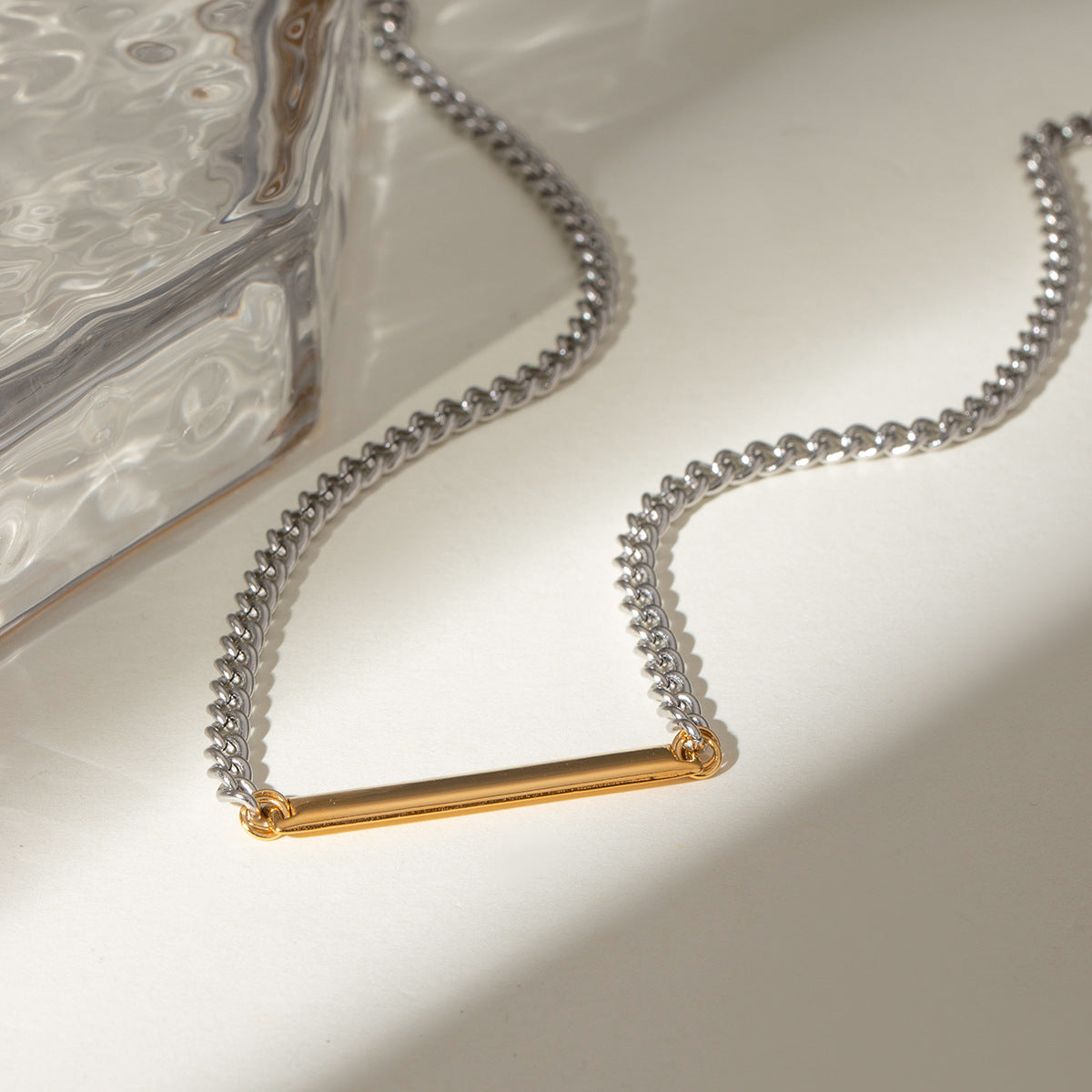Model wearing wholesale stainless steel two tone bar pendant necklace minimalist fashion jewelry