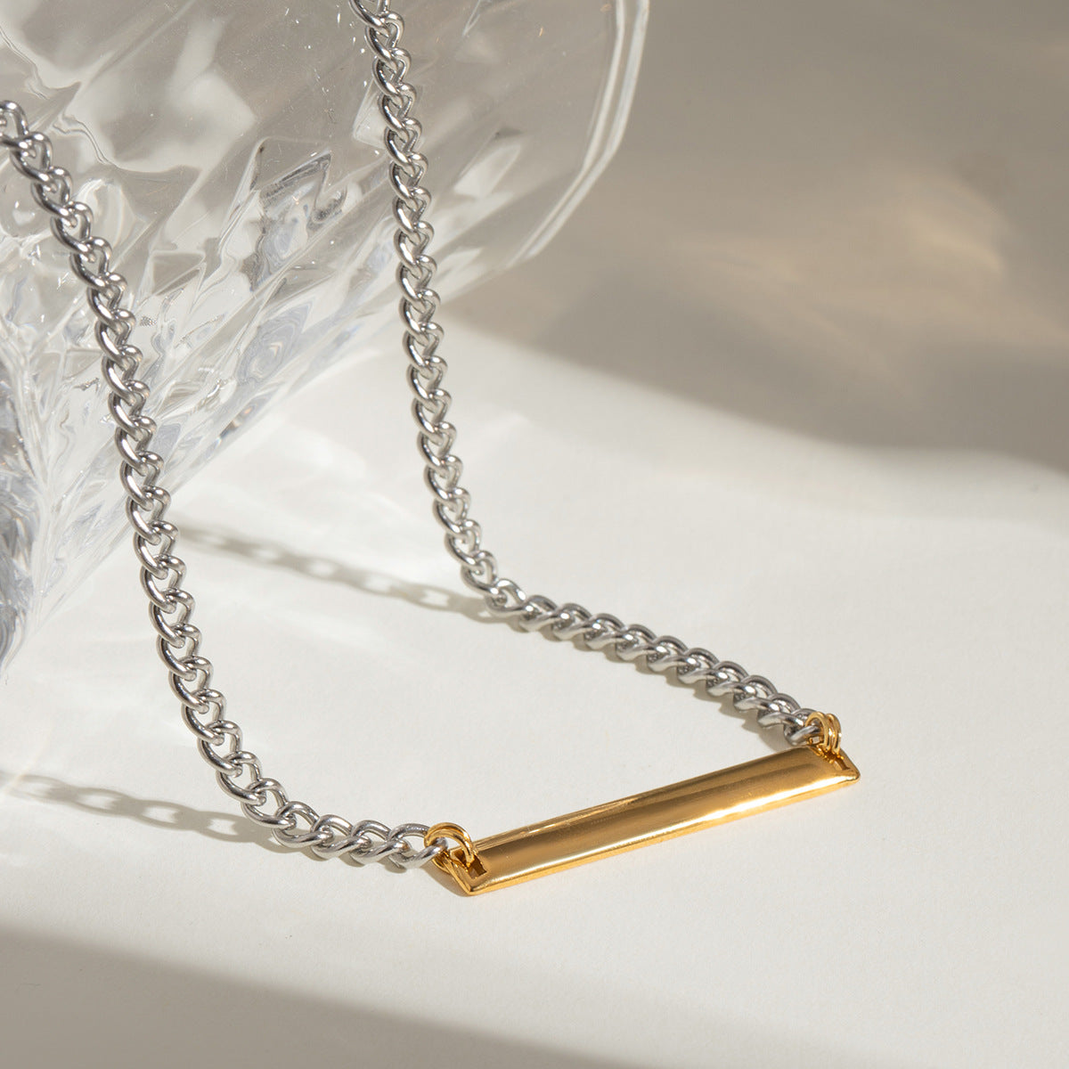 Close up of wholesale stainless steel two tone bar necklace tarnish free minimalist collarbone chain