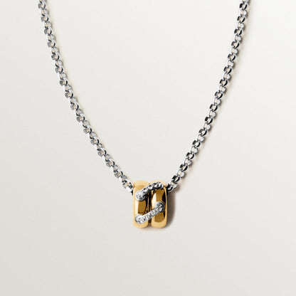 Two tone zircon link pendant necklace with silver tone chain and gold half hoop pendant on white background