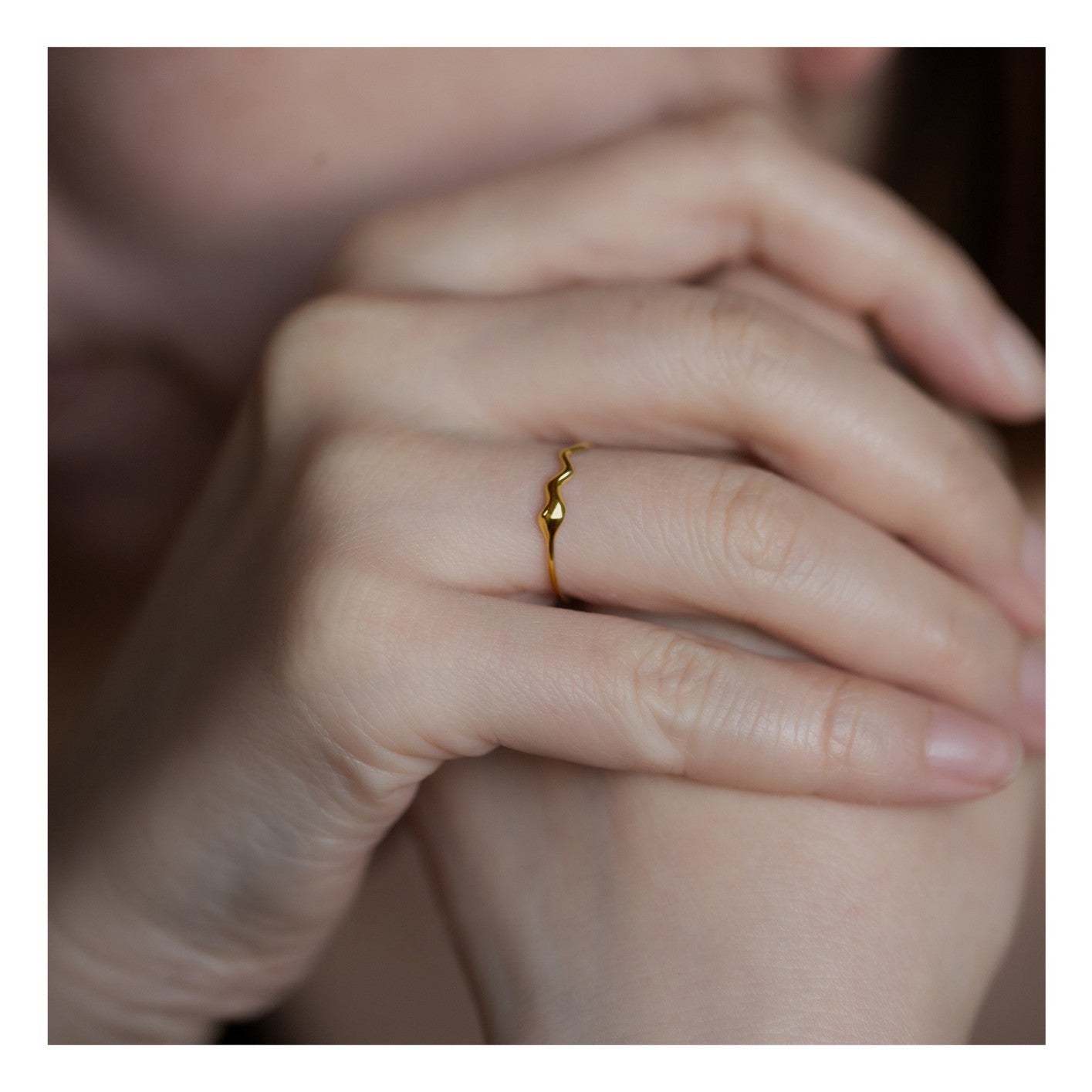S925 sterling silver 18K gold plated water drop inspired wave ring on white background