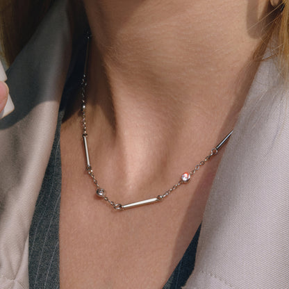 Model wearing stainless steel bar chain necklace with white zircon