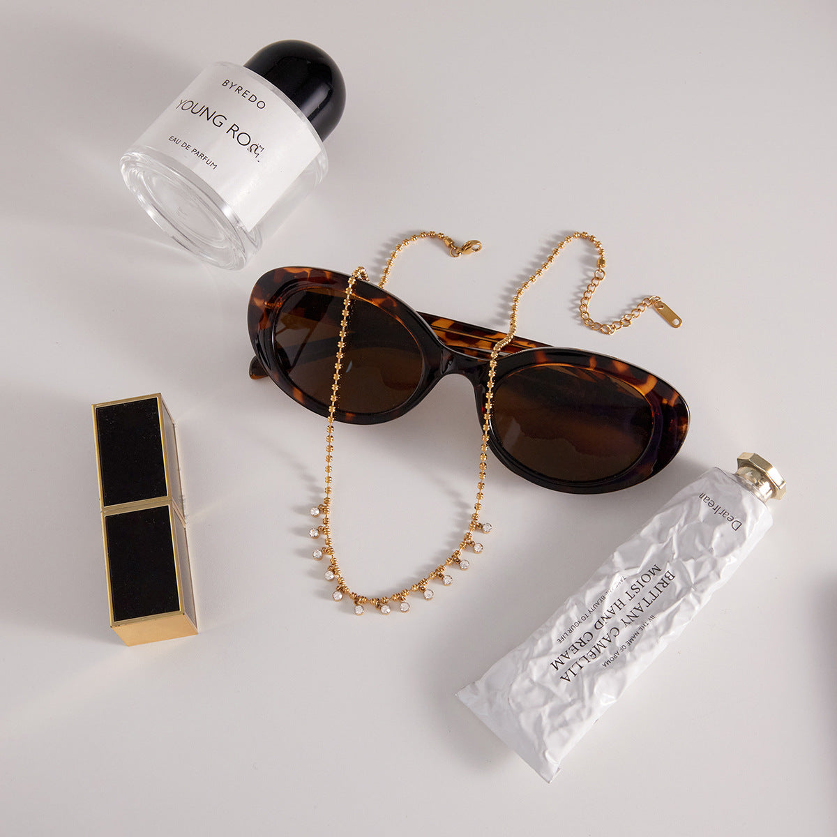 Gold tone stainless steel white zircon necklace flat lay display