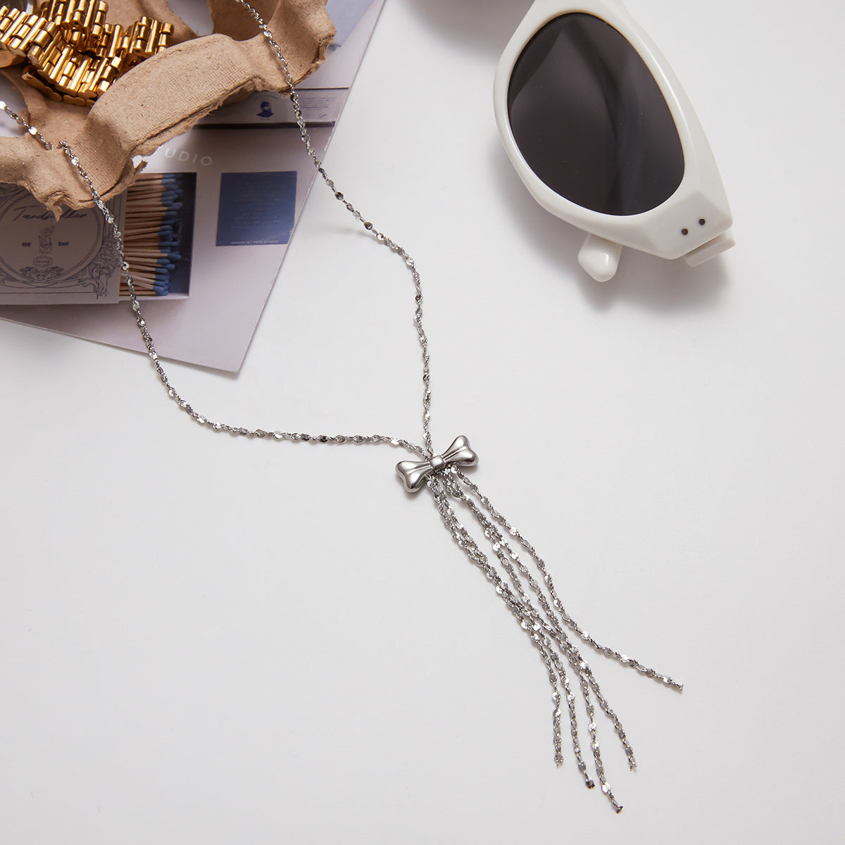 Wholesale stainless steel tassel necklace with bow pendant, waterproof fashion jewelry