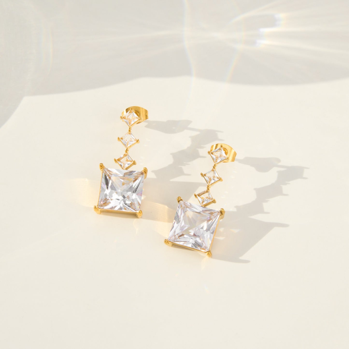 gold tone cz square dangle stud earrings for boutique wholesale closeup