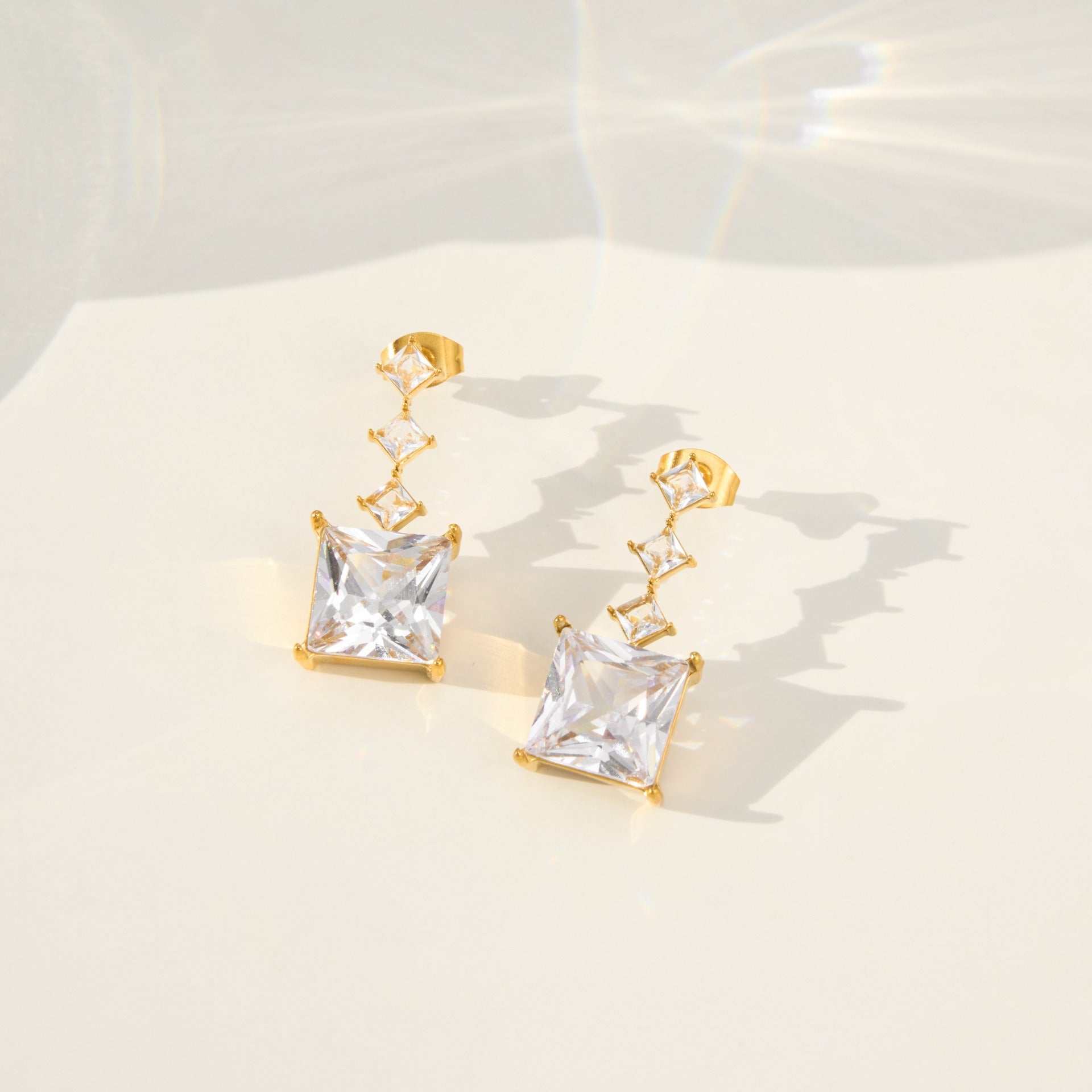 gold tone cz square dangle stud earrings for boutique wholesale closeup
