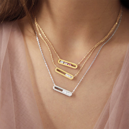 Gold and silver floating cubic zirconia bar necklaces worn in layered styling