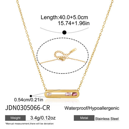 Gold tone floating bar necklace with clear pink and red cubic zirconia stones