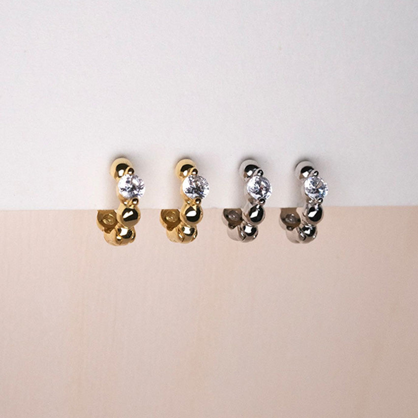 S925 sterling silver huggie earrings in silver and 18K gold plated finishes for wholesale jewelry buyers