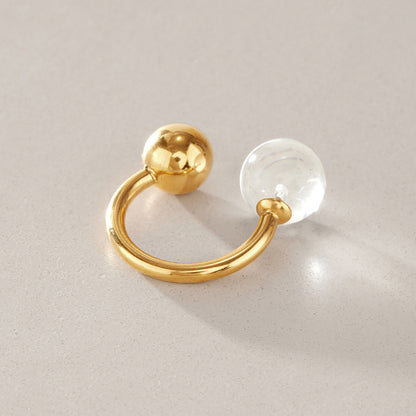 Gold tone open ring with clear resin ball and polished metal ball