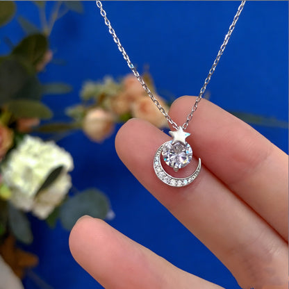 Close up of S999 silver crescent moon star necklace with bright zircon pendant