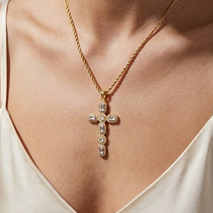 Large cubic zirconia cross pendant necklace worn with a satin top