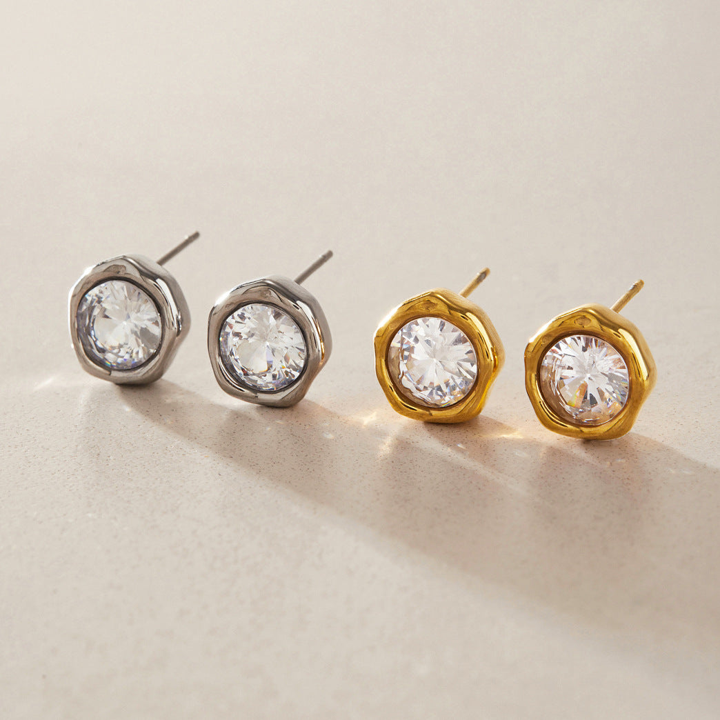 Gold tone stainless steel stud earrings with large clear round zircon stones