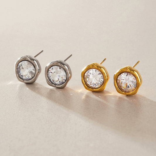 Gold tone stainless steel stud earrings with large clear round zircon stones