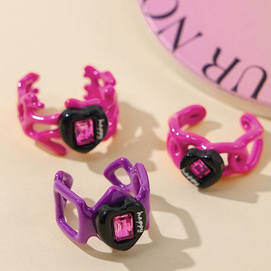 Y2K style heart rings in pink and purple enamel for dopamine fashion.