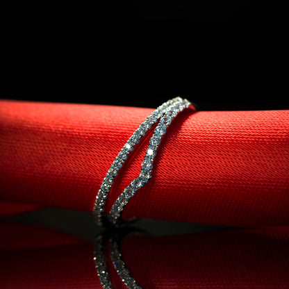 Close up of elegant V shape sterling silver ring featuring brilliant zircon stones