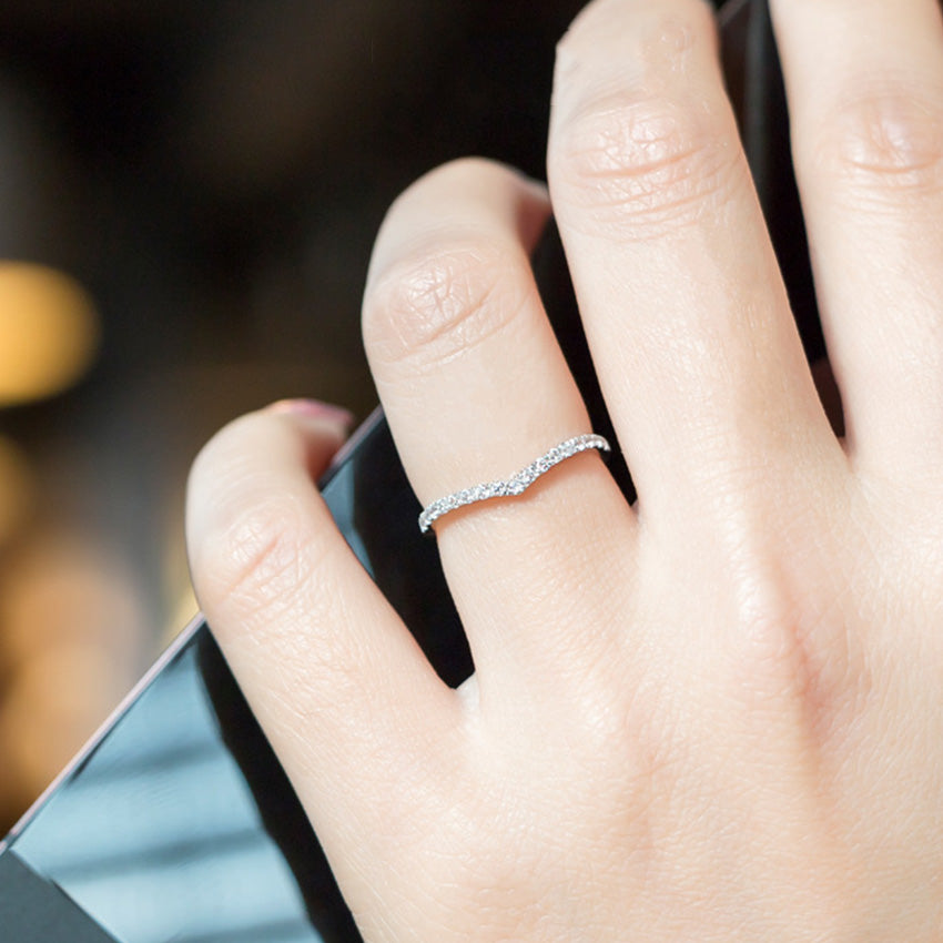 Model wearing slim V shaped zircon ring crafted from 925 sterling silver